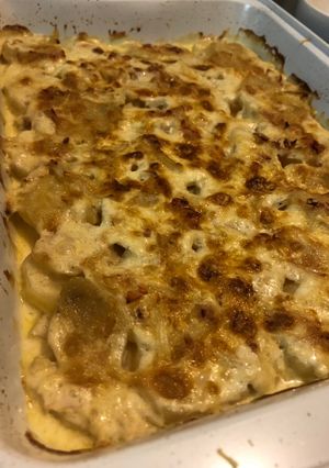 Una foto de Papas a la crema con cebolla y queso