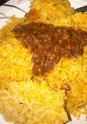 A picture of Jolof rice with vegetable stew.