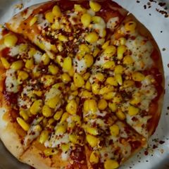 A picture of Sweetcorn pizza.