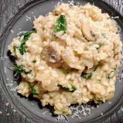 A picture of Mushroom risotto with spinach.