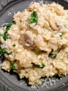 A picture of Mushroom risotto with spinach.