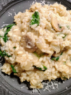 A picture of Mushroom risotto with spinach.