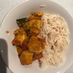A picture of Chicken sauce and long grain rice.