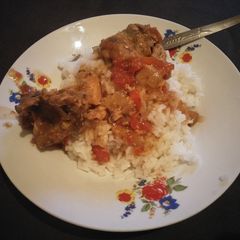 A picture of Stewed beef with rice.