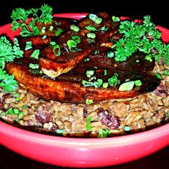 A picture of Mike's Sinfully Sweet & Spicy Plantains Over Red Beans & Rice.