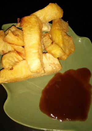 A picture of Sweet potato chips with ketchup.