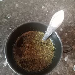 A picture of Mint and Lemon Water with Dried Mint Powder.