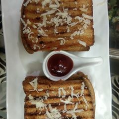 A picture of Three layered cheese grilled sandwich.