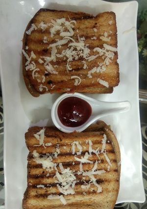 A picture of Three layered cheese grilled sandwich.