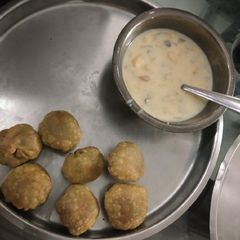 A picture of Tuvar kachori and fruit salad.