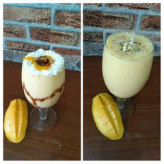 A picture of Mango milk shake with chocolate and nuts.