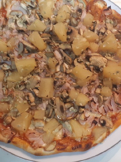 Una foto de Pizza hawaiana