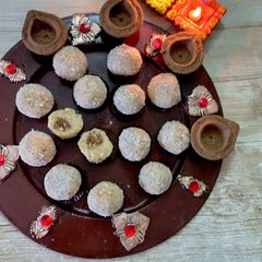 A picture of Stuffed Coconut Ladoo 🥥.