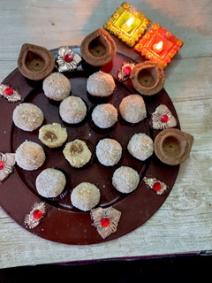 A picture of Stuffed Coconut Ladoo 🥥.