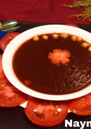 A picture of Red tomatoes carrot soup.