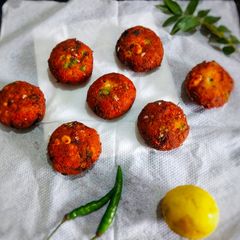 A picture of Veggies and peanut tikki.
