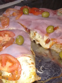 Una foto de Pizza integral porteña