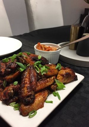 A picture of Buffalo wings with homemade sauce.