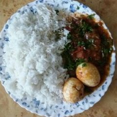 A picture of Rice and egg curry.