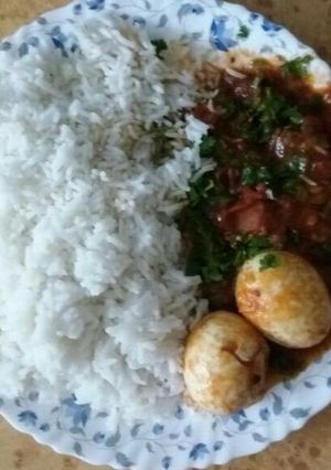 A picture of Rice and egg curry.
