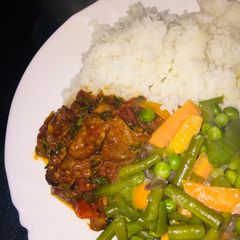 A picture of Rice and beef wet fry.