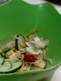 A picture of Green salad with cheese.