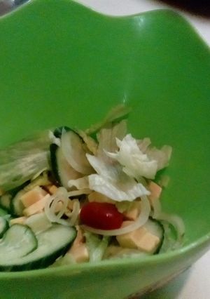 A picture of Green salad with cheese.