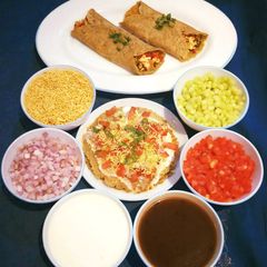 A picture of Stuffed Moong Dal Chilla Chaat.