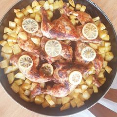 A picture of Baked chicken and potatoes.