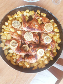 A picture of Baked chicken and potatoes.