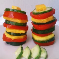 A picture of Tomato Mango Cucumber Salad Towers.