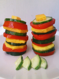 A picture of Tomato Mango Cucumber Salad Towers.