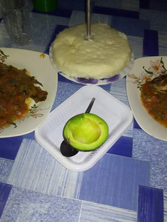 A picture of Fish Stew with Ugali and Avocado.