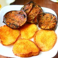 A picture of Fried brinjals and potatoes.