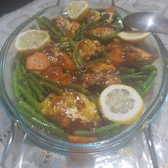 A picture of Pan fried salmon with green beans and sauce.