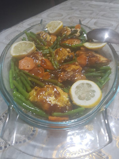 A picture of Pan fried salmon with green beans and sauce.