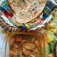 A picture of Chicken degi korma with homemade naan.