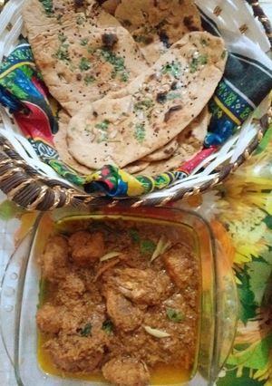 A picture of Chicken degi korma with homemade naan.