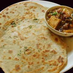 A picture of Paneer stuffed masala parotta.