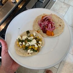 A picture of Tacos two ways with home made tortillas.