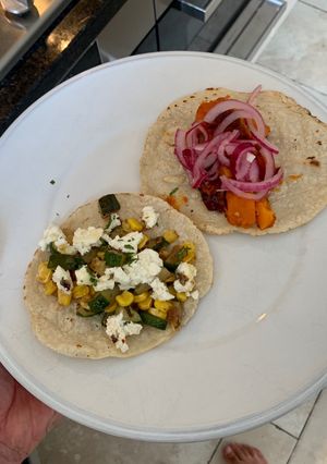 A picture of Tacos two ways with home made tortillas.