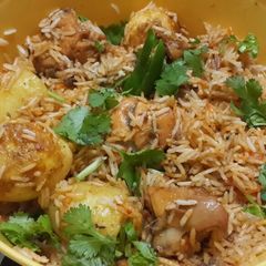 A picture of Hyderabadi Chicken Biryani in microwave.