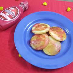 A picture of Vanilla Pancakes with Strawberry Sauce.