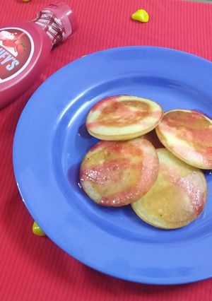 A picture of Vanilla Pancakes with Strawberry Sauce.