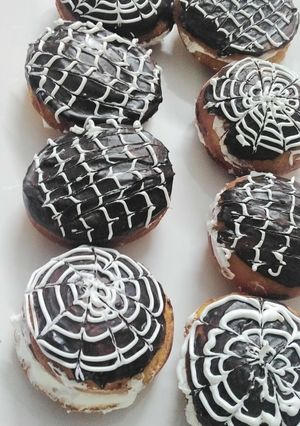 A picture of Donut with vanilla frosting.