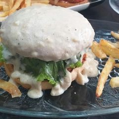 A picture of Stuffed chicken lava burger with cream cheese sauce.