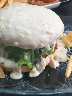 A picture of Stuffed chicken lava burger with cream cheese sauce.