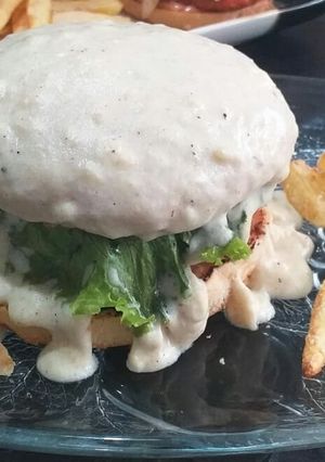 A picture of Stuffed chicken lava burger with cream cheese sauce.