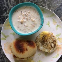A picture of Homemade bun with egg half fry.
