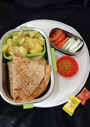 A picture of Masala Paratha and aloo sabzi.